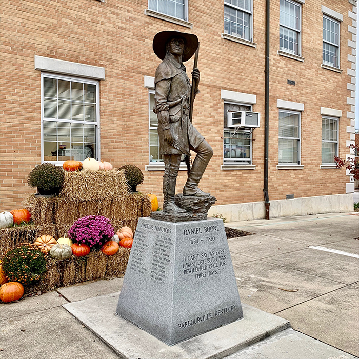 Bronze statue of a man with a gun